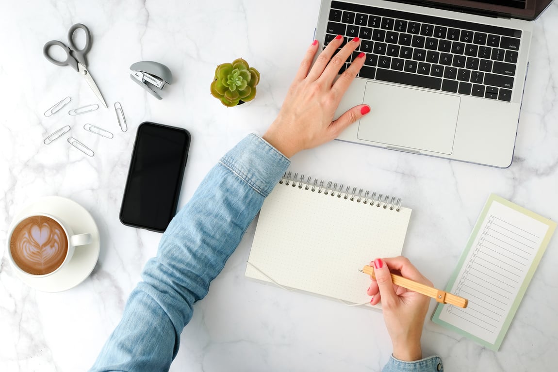 Woman Working on Contemporary Office Desk Flatlay