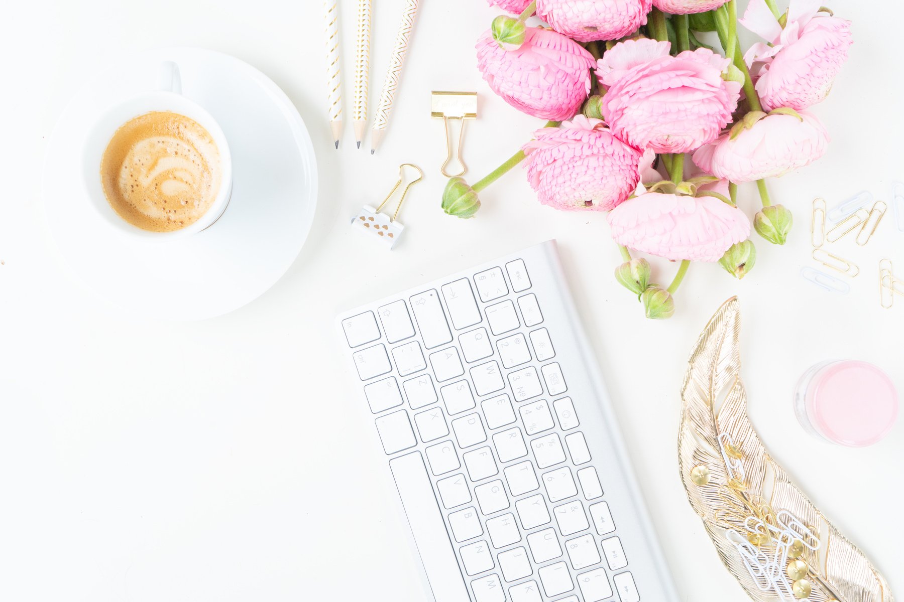 Pink Flowers and Coffee on Feminine Office Desk Flatlay